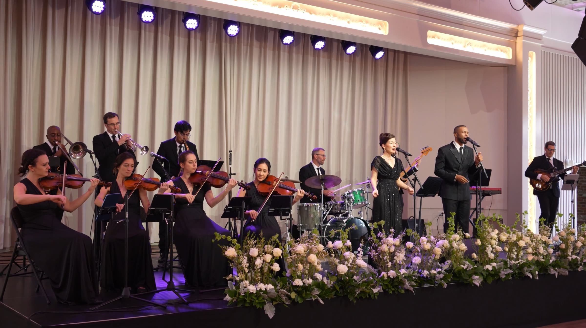Full band performing for event