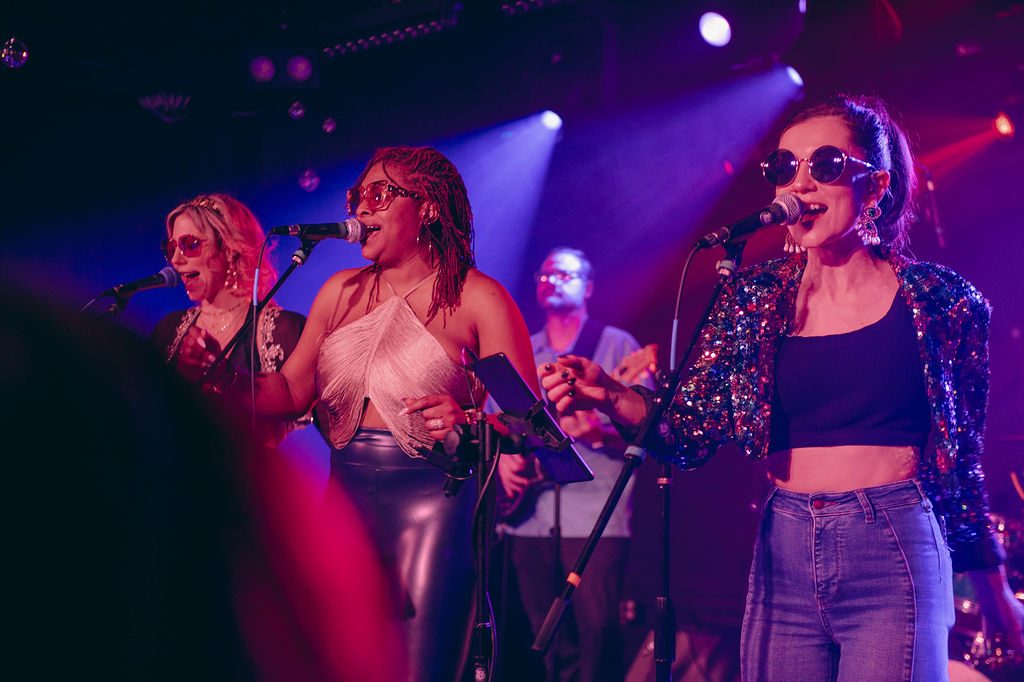 Liz Kelley performing with vocalists