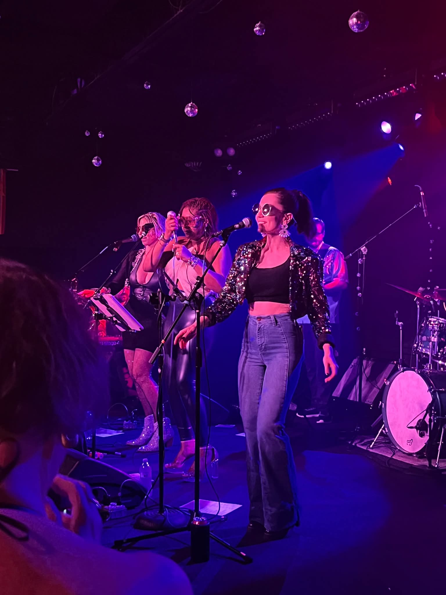 Liz Kelley on stage with the band