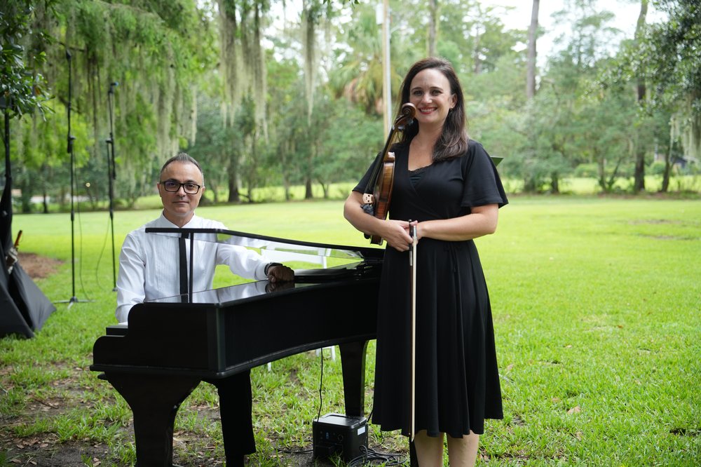 Piano and strings performing